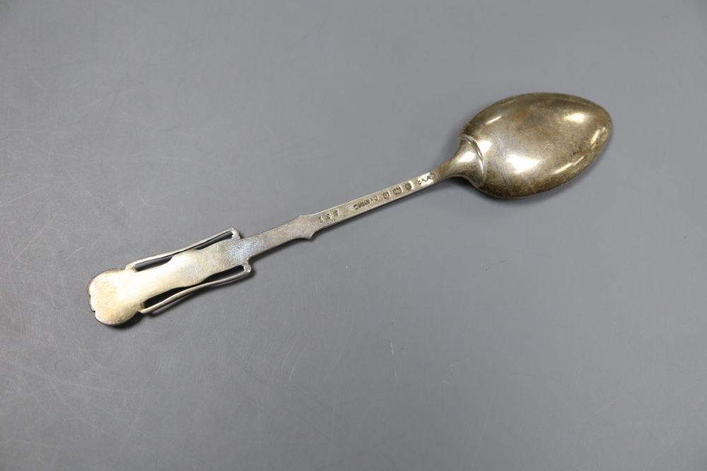 An Edwardian Art Nouveau Liberty & Co Cymric silver coffee spoon, with stylised terminal, Birmingham, 1904, 11cm, 12.5 grams.